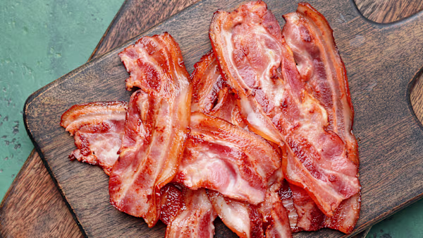 Can Dogs Eat Bacon? Risks, Safety & Better Treats