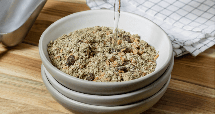 Water being poured into a dehydrated recipe made by The Honest Kitchen.