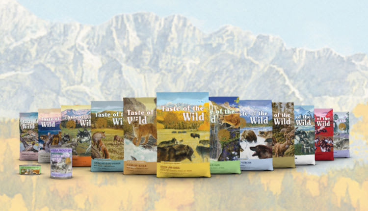 Pack shots of Taste of the Wild with a mountain in the background.