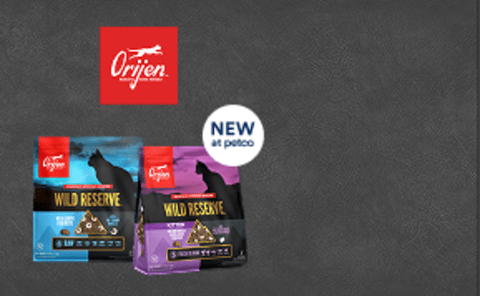 Orijen logo with 2 bags of food and a food bowl with dog kibble and shrimp on top.