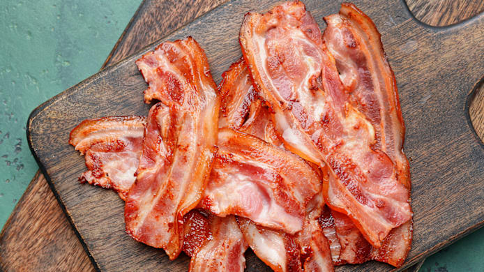Can Dogs Eat Bacon? Risks, Safety & Better Treats